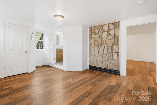 unfurnished room featuring hardwood / wood-style floors