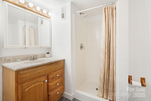 bathroom featuring vanity and walk in shower