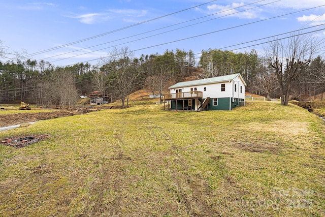 view of yard featuring a wooden deck