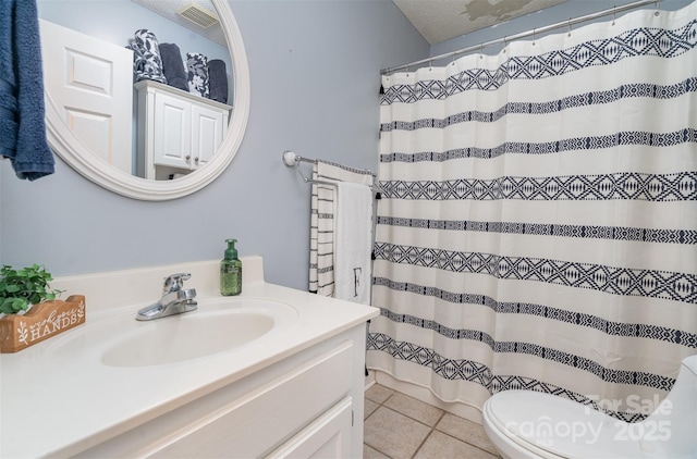 bathroom featuring vanity, toilet, tile patterned floors, a textured ceiling, and a shower with shower curtain