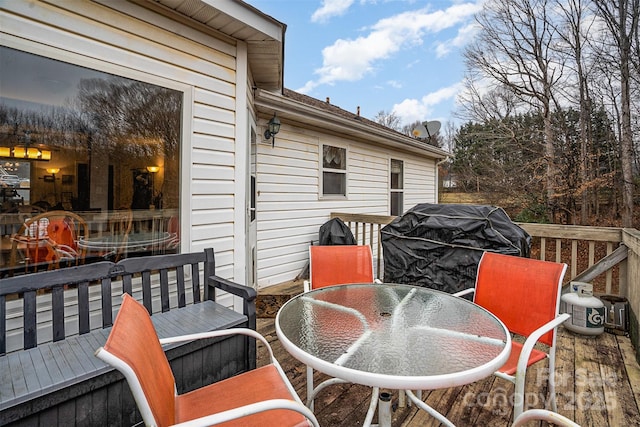 wooden deck with grilling area