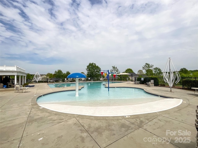 view of swimming pool featuring a patio and pool water feature