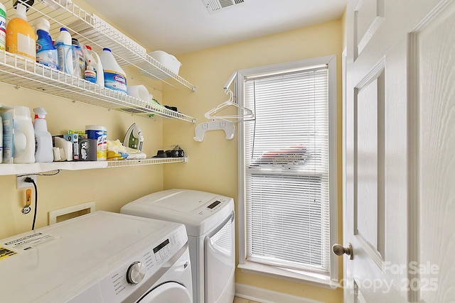 washroom with separate washer and dryer