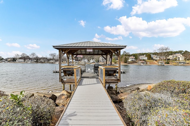 view of dock featuring a water view and a gazebo