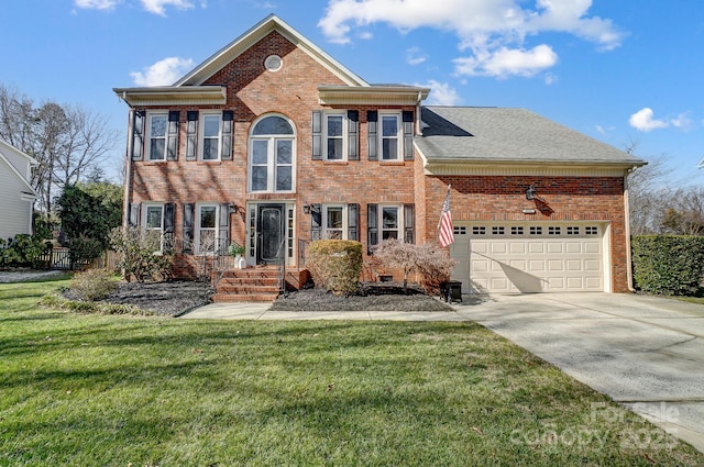 view of front of property with a garage and a front lawn