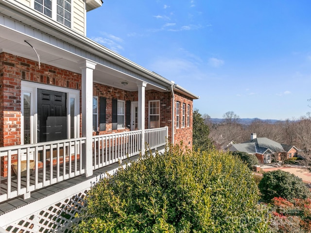 view of property exterior with covered porch