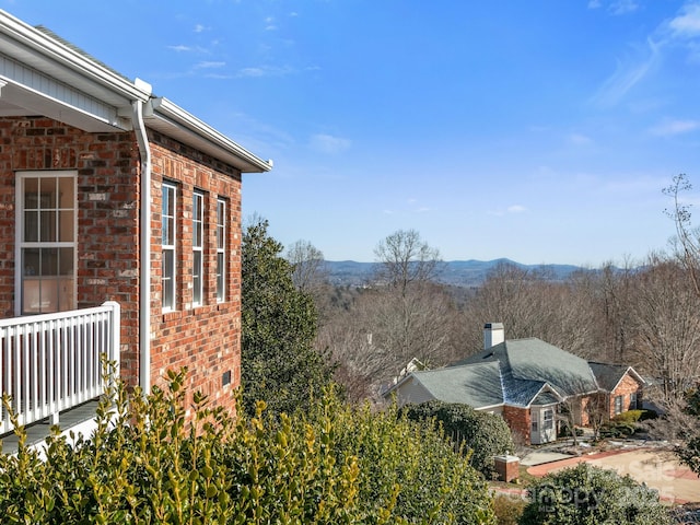 view of side of property with a mountain view