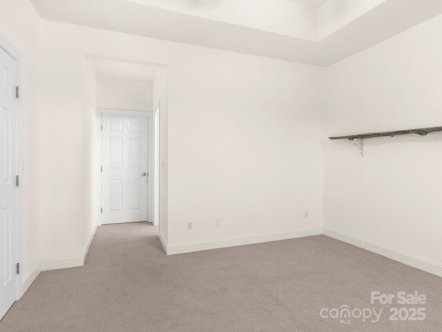 spare room with light colored carpet