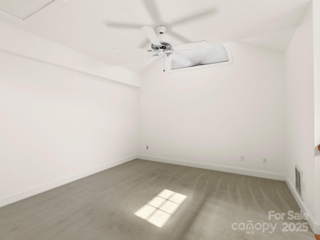 empty room with ceiling fan and carpet flooring