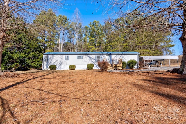 view of front of home with a carport