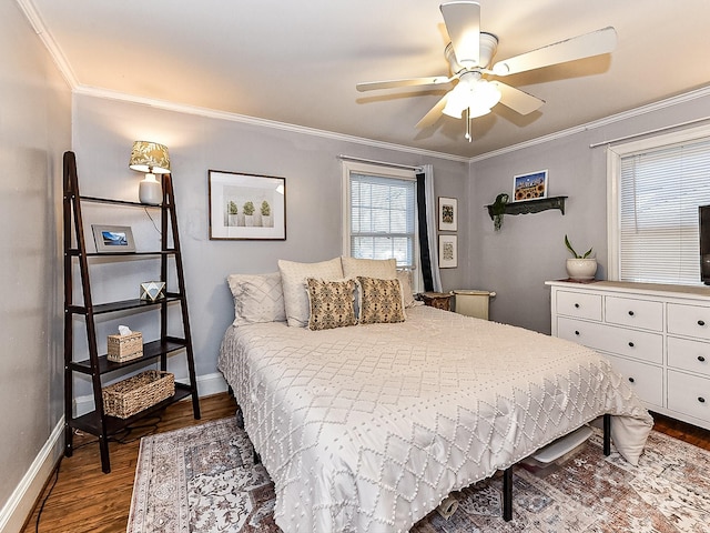 bedroom featuring ceiling fan, wood-type flooring, and crown molding