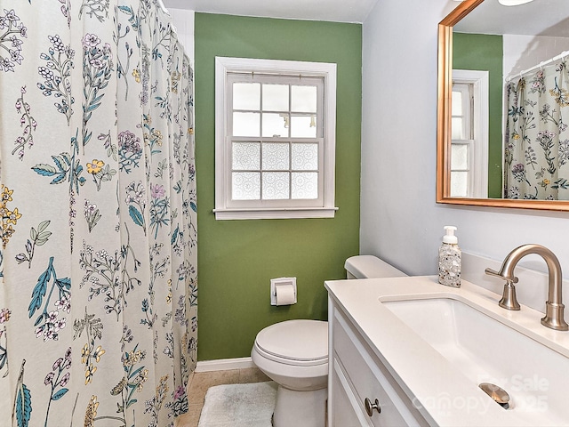 bathroom with vanity, toilet, and a shower with curtain