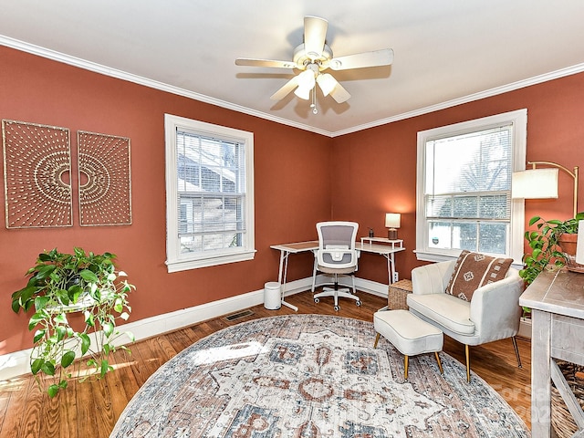 home office with crown molding, hardwood / wood-style floors, ceiling fan, and a wealth of natural light