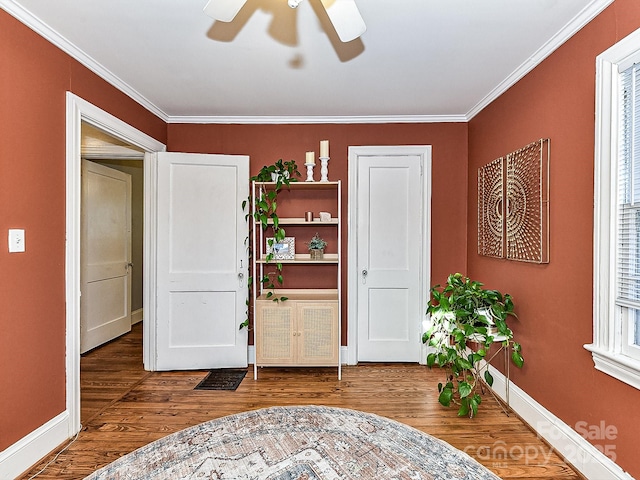 living area with ornamental molding, ceiling fan, and hardwood / wood-style floors