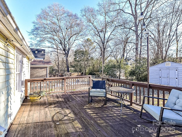 wooden terrace featuring a storage shed