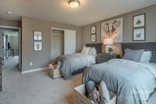 carpeted bedroom featuring a closet