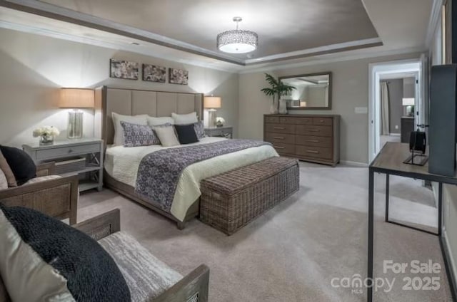 bedroom featuring light carpet, ornamental molding, and a raised ceiling