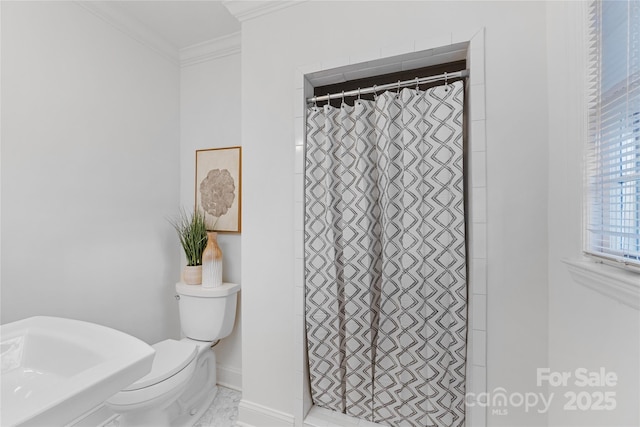 bathroom with crown molding, toilet, and walk in shower