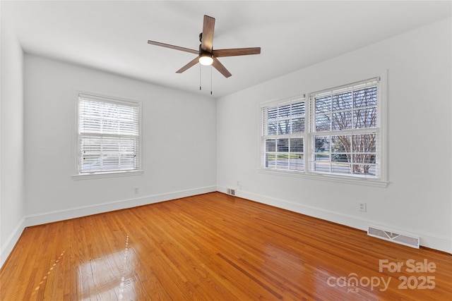 unfurnished room featuring hardwood / wood-style floors and ceiling fan