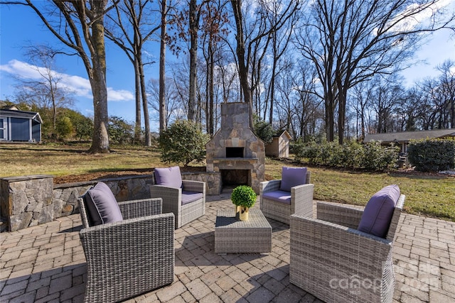 view of patio with a storage shed and an outdoor living space