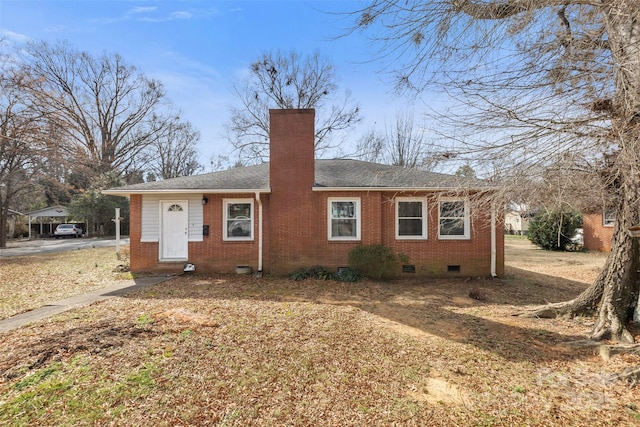 ranch-style home featuring brick siding, crawl space, a chimney, and a shingled roof