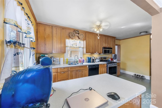 kitchen featuring a sink, brown cabinets, stainless steel appliances, and light countertops