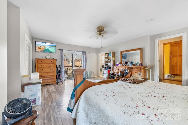 bedroom with a ceiling fan and wood finished floors