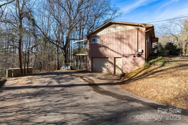 view of side of property with a garage