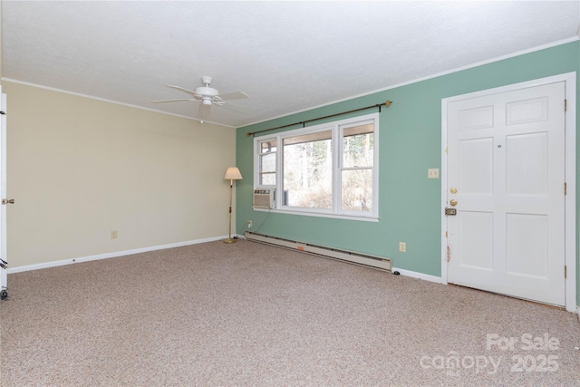 spare room featuring ceiling fan, baseboard heating, ornamental molding, a textured ceiling, and light carpet