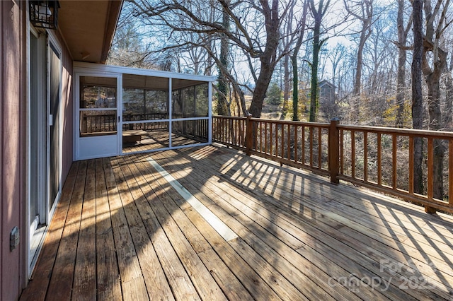 deck with a sunroom