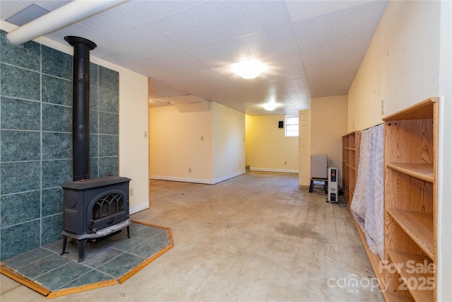 basement featuring a wood stove