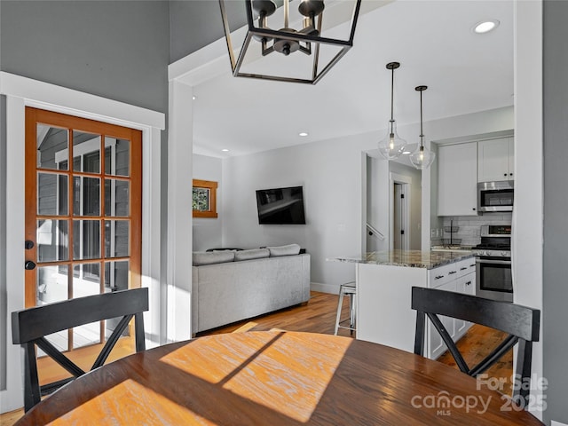 dining space featuring light hardwood / wood-style flooring