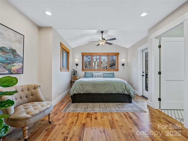 bedroom featuring ceiling fan, access to exterior, hardwood / wood-style floors, and vaulted ceiling