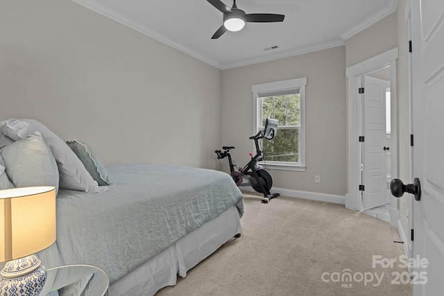 carpeted bedroom with ceiling fan and ornamental molding