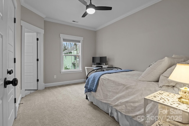 carpeted bedroom with ceiling fan and crown molding