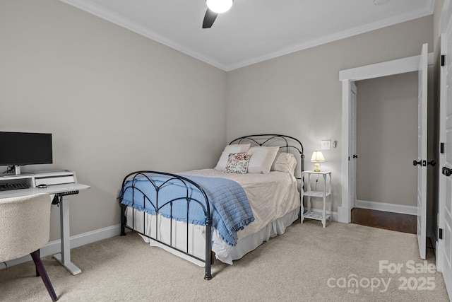 carpeted bedroom featuring crown molding and ceiling fan