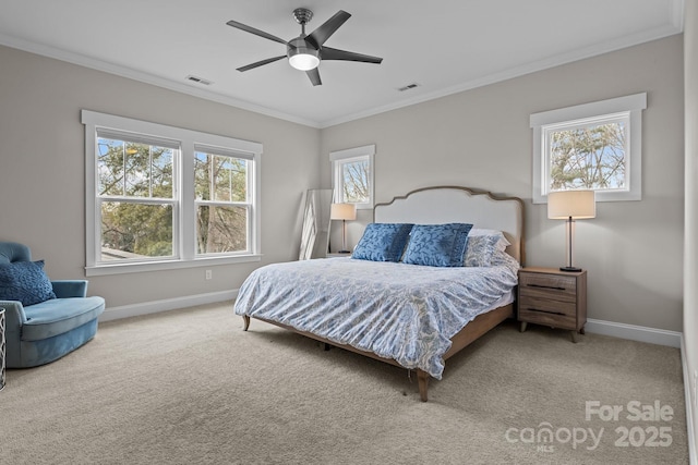 carpeted bedroom with ceiling fan and ornamental molding