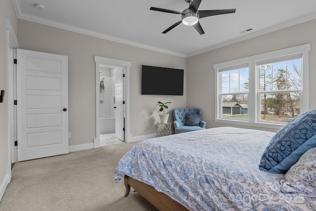 carpeted bedroom featuring crown molding, ensuite bath, and ceiling fan