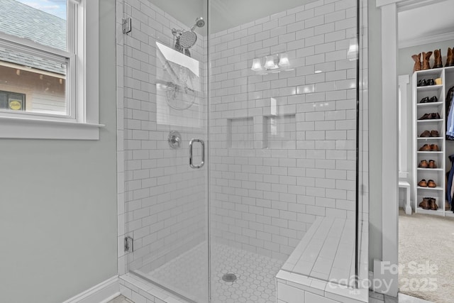 bathroom featuring a shower with shower door