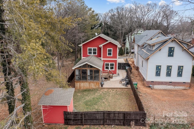 view of front of house featuring a front lawn and a sunroom