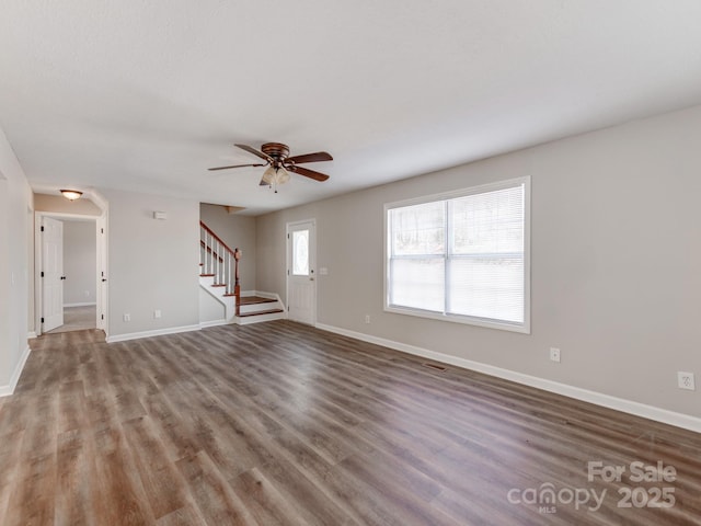 unfurnished living room with hardwood / wood-style floors and ceiling fan