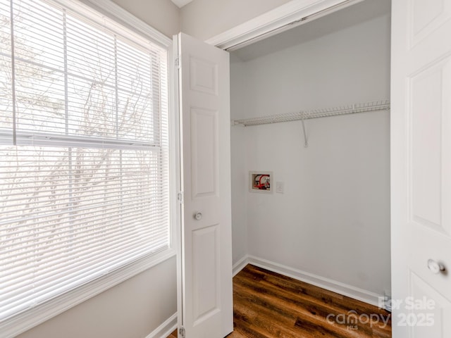 laundry area with dark wood-type flooring and washer hookup