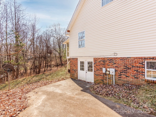 view of side of property featuring a patio area