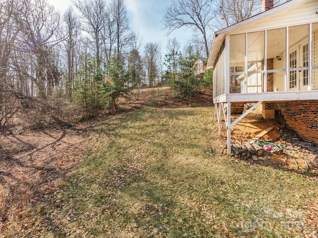 view of yard with a sunroom