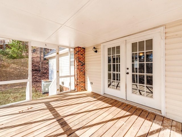 unfurnished sunroom with french doors