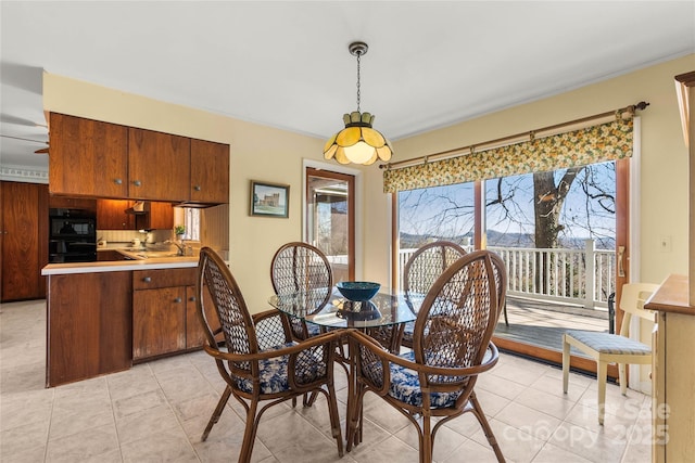 dining area with light tile patterned floors