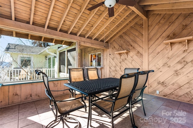 view of patio with a ceiling fan and outdoor dining space