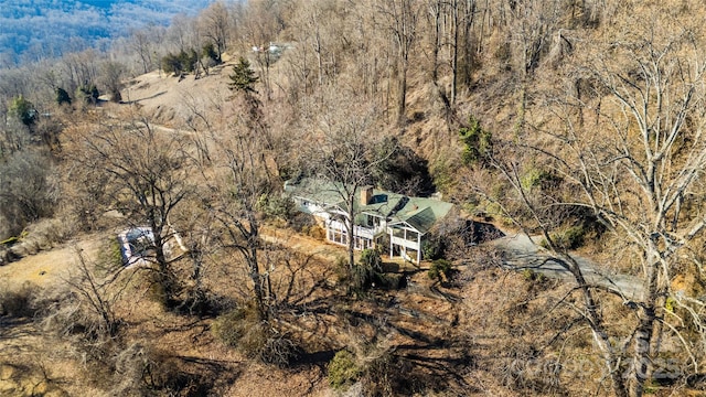 drone / aerial view featuring a view of trees