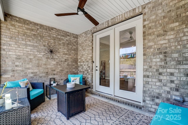 view of patio with an outdoor living space, french doors, and a ceiling fan