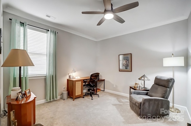 office featuring visible vents, baseboards, light colored carpet, and a ceiling fan